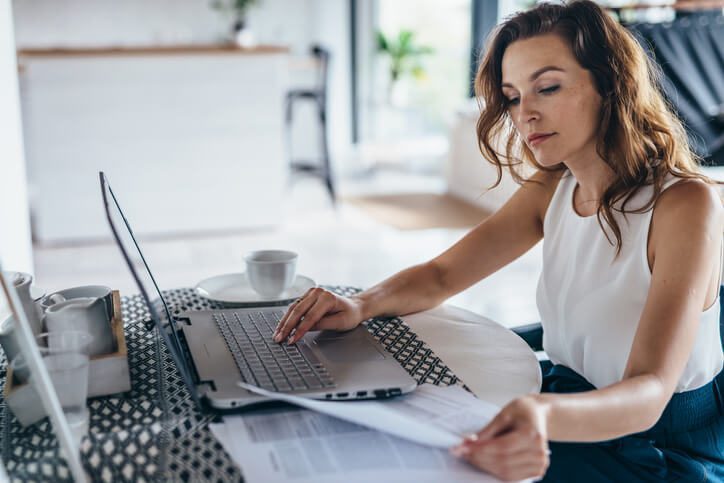 Woman looking on data for optimal margin