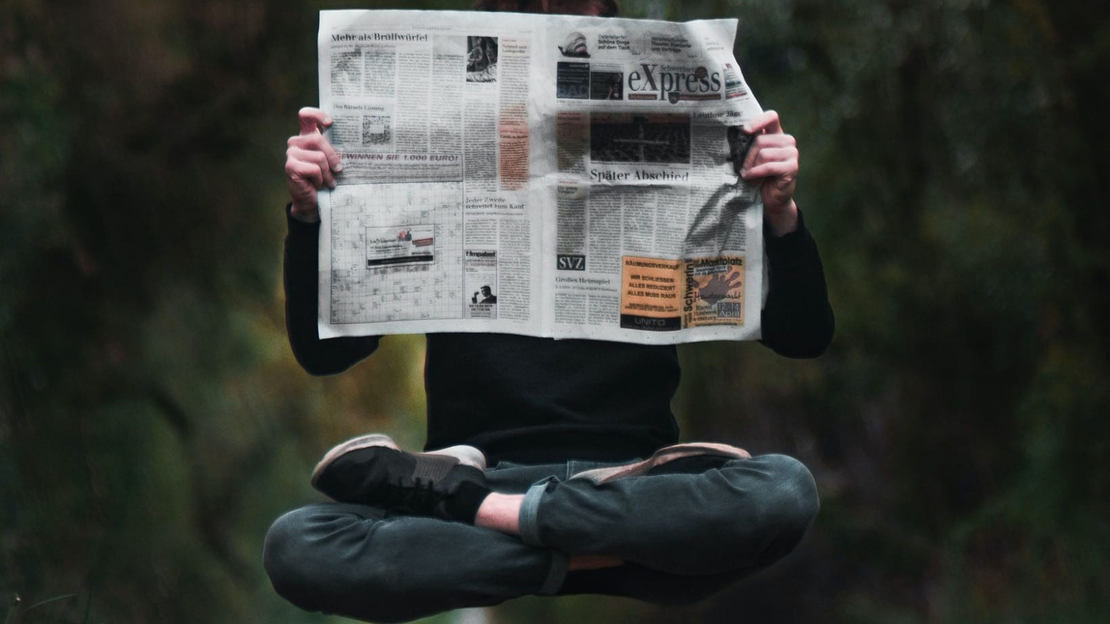 Strix aluco, Tawny owl  flying above tombstones in cemetery. Wildlife scene nature